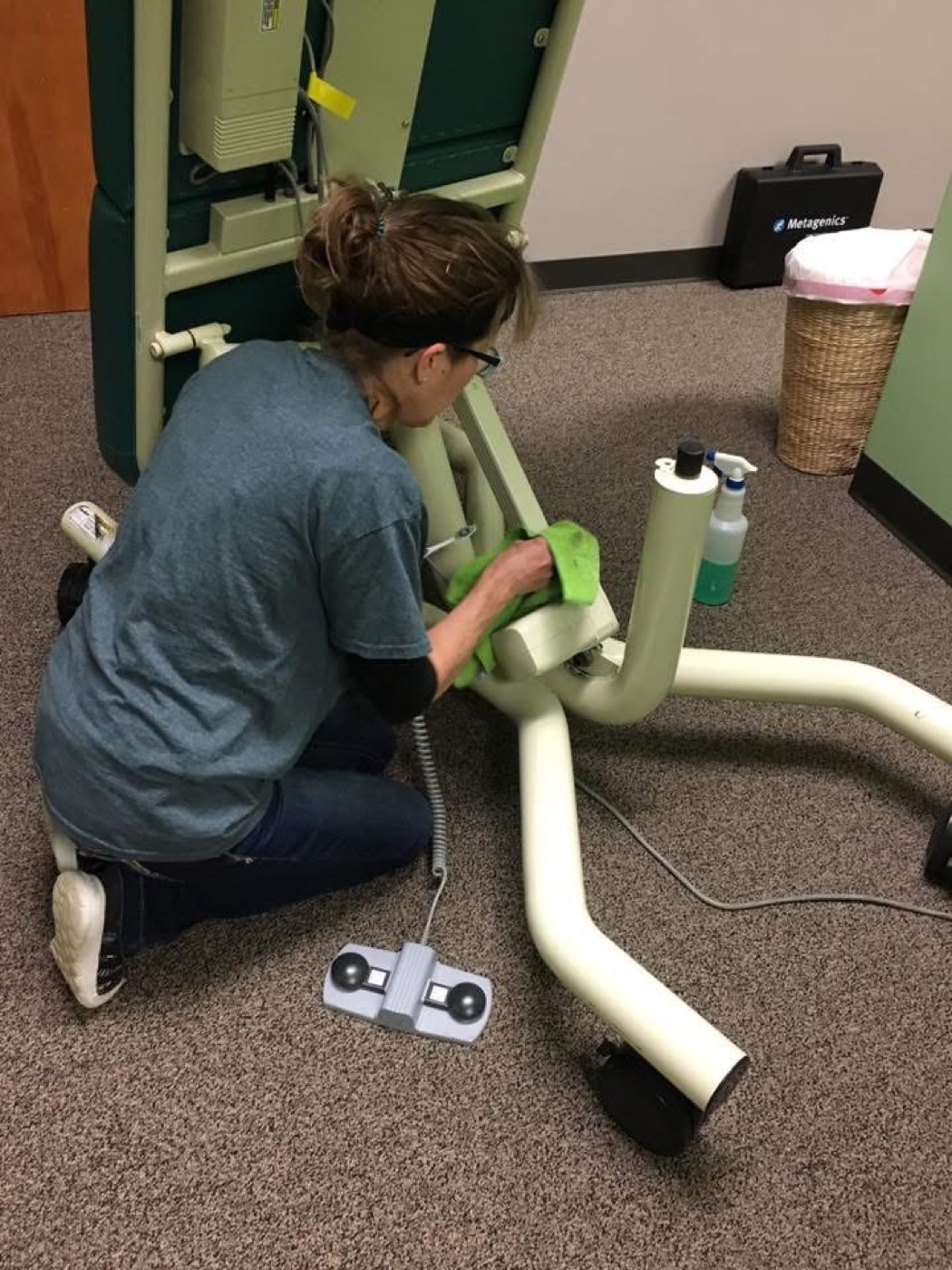 Squeeky Klean technician cleaning medical clinic equipment